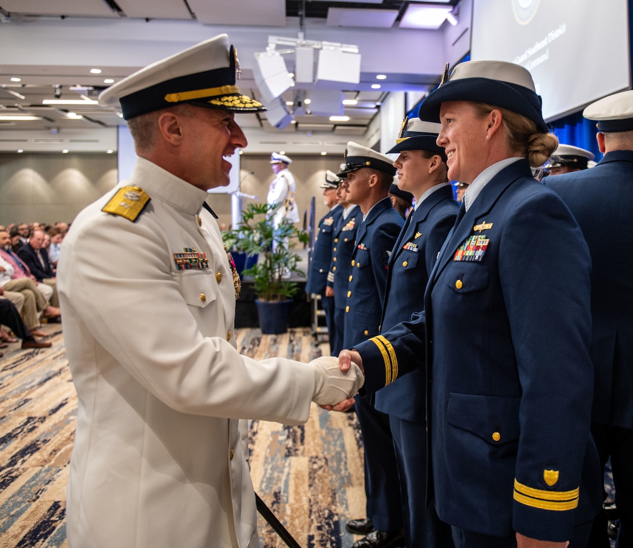 Coast Guard officer greets members of Coast Guard Southeast District