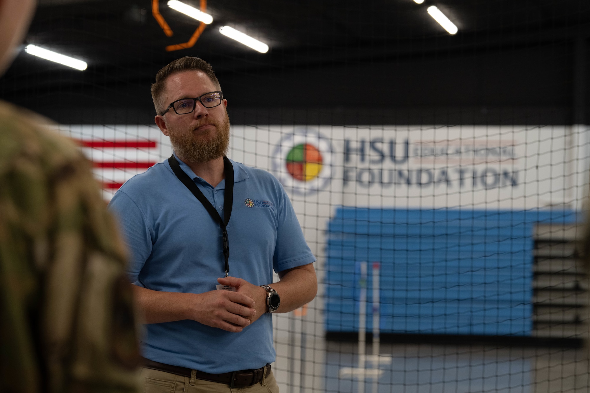 Josh Hollenback, HSU Education Foundation unmanned aerial vehicle and science, technology, engineering and mathematics coordinator introduces Air Commandos from the 1st Special Operations Wing to a drone-flight room at a HSU campus near Hurlburt Field, Florida, July 8, 2025.