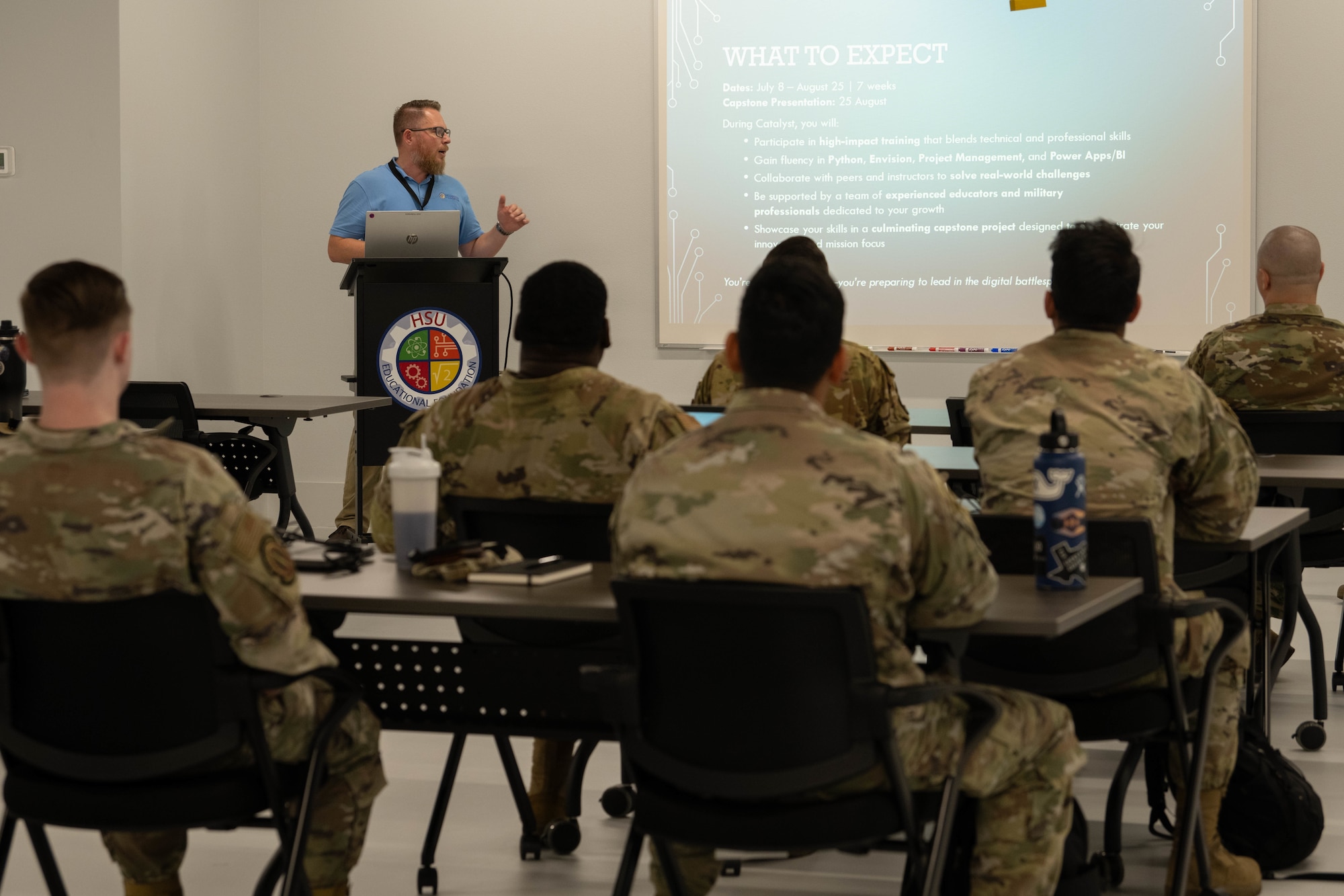 Josh Hollenback, HSU Education Foundation unmanned aerial vehicle and science, technology, engineering and mathematics coordinator, gives a presentation to Air Commandos during the Critical Analysis Training Accelerator: Learning to Yield Solutions through Technology course kickoff at an HSU building near Hurlburt Field, Florida, July 8, 2025.