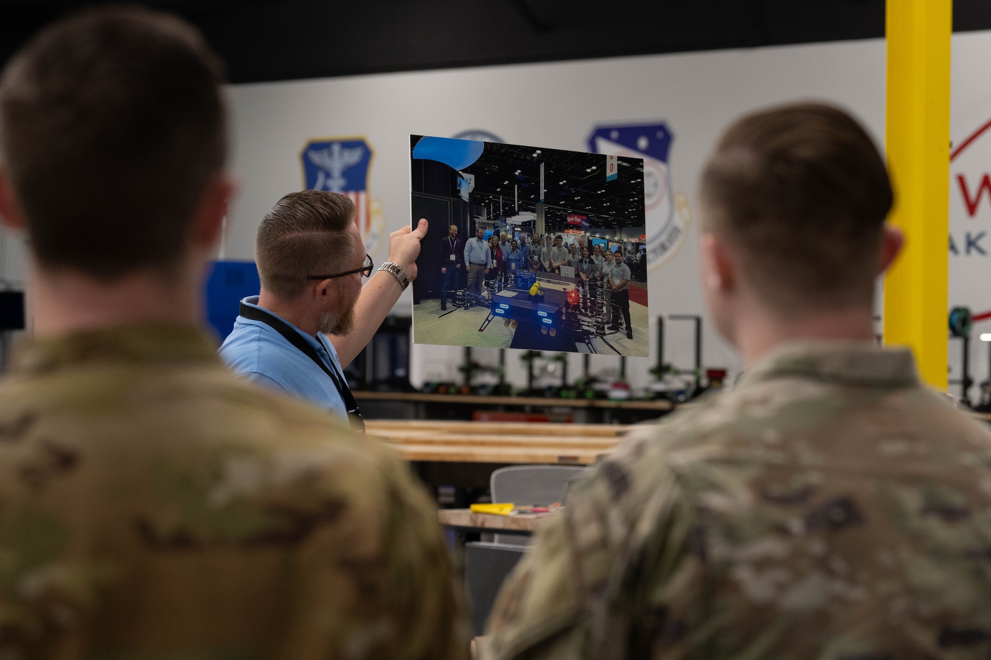 Josh Hollenback, HSU Education Foundation unmanned aerial vehicle and science, technology, engineering and mathematics coordinator, leads Air Commandos from the 1st Special Operations Wing on a tour of a HSU campus building near Hurlburt Field, Florida, July 8, 2025.