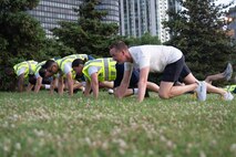 U.S. Marines assigned to Special Purpose Marine Air-Ground Task Force-250 lead a physical training session for Chicago Police Department recruits at DuSable Harbor during Marine Week Chicago, July 10, 2025. Throughout 2025, Marines across the globe will celebrate the 250th birthday of the Corps, commemorating service, sacrifice, and priding themselves on living ‘Semper Fidelis’ or ‘Always Faithful’ to their nation and to each other. (U.S. Marine Corps photo by Lance Cpl. Andra Marton-Salgado)