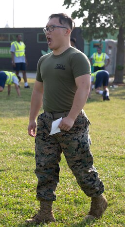 U.S. Marine Corps Lance Cpl. Poom Pasapong, an administrative specialist assigned to Special Purpose Marine Air-Ground Task Force-250, leads physical training with Chicago Police Department recruits at DuSable Harbor during Marine Week Chicago, July 10, 2025. Throughout the year, Marines across the globe will celebrate the 250th birthday of the Corps, commemorating service, sacrifice, and priding themselves on living ‘Semper Fidelis’ or ‘Always Faithful’ to their nation and to each other. (U.S. Marine Corps photo by Lance Cpl. Andra Marton-Salgado)