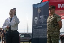 Caption: U.S. Marine Corps Lt Col. Eric Perez, an operations and plans officer assigned to Special Purpose Marine Air-Ground Task Force-250, awards Migdalia Bulnes, the deputy chief of Training and Support Group, Chicago Police Department, with a 250th Marine Corps birthday uniform patch at DuSable Harbor during Marine Week Chicago, July 10, 2025. Throughout 2025, Marines across the globe will celebrate the 250th birthday of the Corps, commemorating service, sacrifice, and priding themselves on living ‘Semper Fidelis’ or ‘Always Faithful’ to their nation and to each other. (U.S. Marine Corps photo by Lance Cpl. Andra Marton-Salgado)