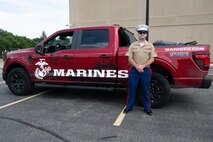 U.S. Marine Corps Sgt. Dalton Payne, a recruiting station marketing and communications Marine with 9th Marine Corps District Headquarters, assigned to Special Purpose Marine Air-Ground Task Force-250, poses for a portrait at Romeoville High School during Marine Week Chicago, July 10, 2025. Romeoville High School hosted a community event to celebrate the Marine Corps' upcoming 250th birthday. Throughout 2025, Marines across the globe will celebrate the birthday of the Corps, commemorating service, sacrifice, and priding themselves on living ‘Semper Fidelis’ or ‘Always Faithful’ to their nation and to each other. (U.S. Marine Corps photo by Lance Cpl. Andra Marton-Salgado)