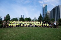 U.S. Marines assigned to Special Purpose Marine Air-Ground Task Force-250, and Chicago Police Department recruits, pose for a photo at DuSable Harbor during Marine Week Chicago, July 10, 2025.Throughout the, Marines across the globe will celebrate the 250th birthday of the Corps, commemorating service, sacrifice, and priding themselves on living ‘Semper Fidelis’ or ‘Always Faithful’ to their nation and to each other. (U.S. Marine Corps photo by Lance Cpl. Andra Marton-Salgado)