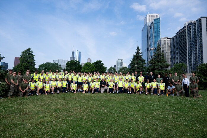 U.S. Marines assigned to Special Purpose Marine Air-Ground Task Force-250, and Chicago Police Department recruits, pose for a photo at DuSable Harbor during Marine Week Chicago, July 10, 2025.Throughout the, Marines across the globe will celebrate the 250th birthday of the Corps, commemorating service, sacrifice, and priding themselves on living ‘Semper Fidelis’ or ‘Always Faithful’ to their nation and to each other. (U.S. Marine Corps photo by Lance Cpl. Andra Marton-Salgado)