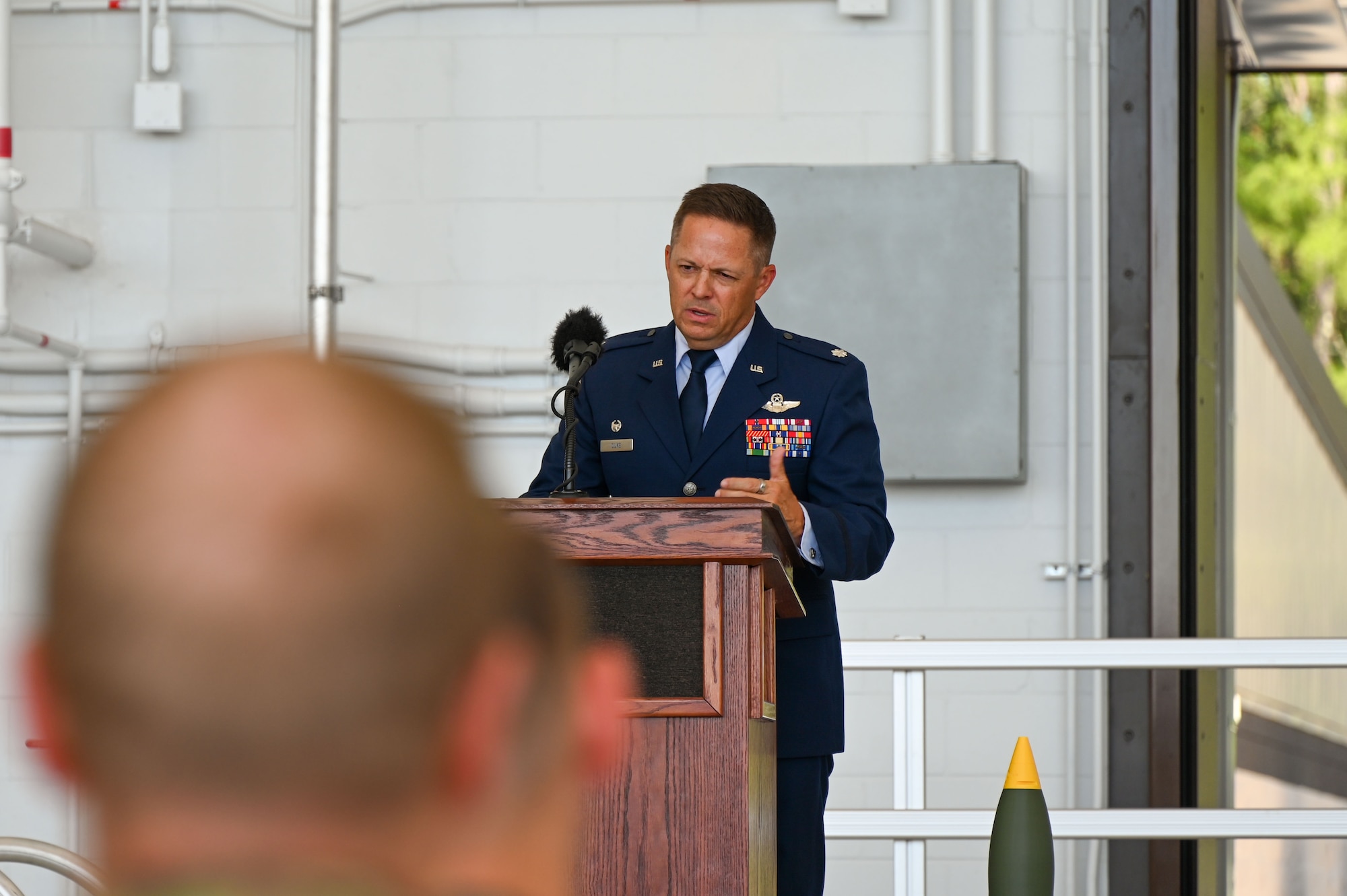 U.S. Air Force Reserve Lt. Col. John Duke, outgoing 711th Special Operations Squadron commander, delivers a speech during a change of command ceremony at Hurlburt Field, Florida, July 11, 2025. In addition to the change of command, the event marked the squadron’s transition to an operational AC-130J Ghostrider gunship mission.  (U.S. Air Force photo by Liz Easterling)