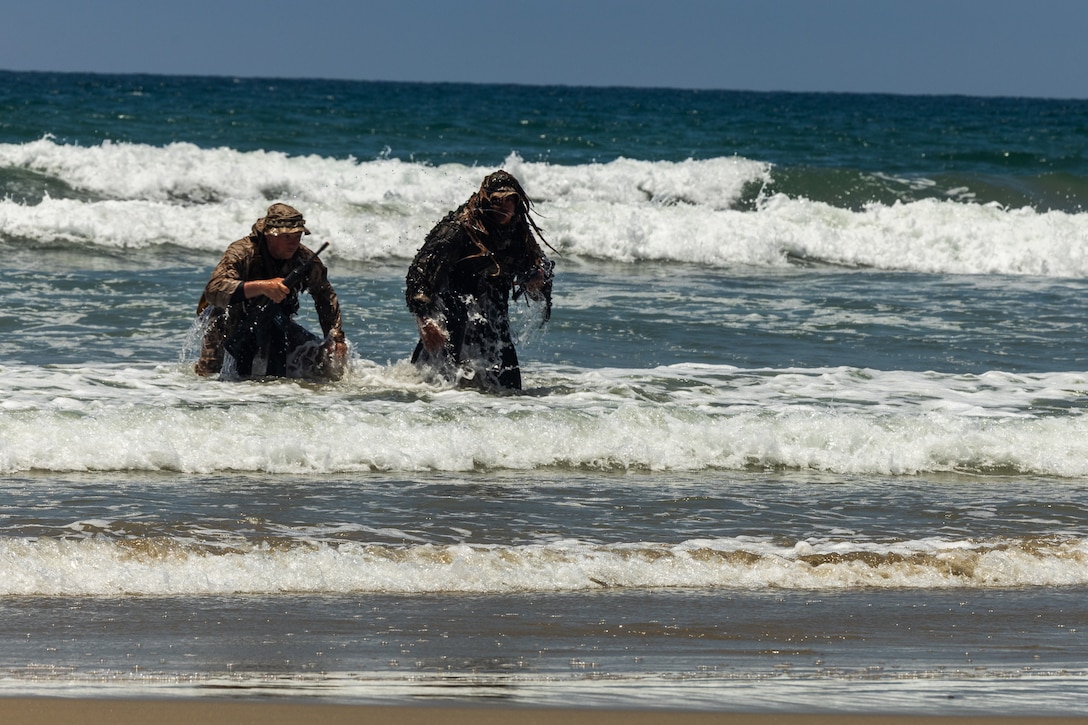 U.S. Marines with 3rd Battalion, 1st Marine Regiment, 1st Marine Division, conduct beach reconnaissance during a boat raid course hosted by Expeditionary Operations Training Group, I Marine Expeditionary Force, at Marine Corps Base Camp Pendleton, California, June 25, 2025.