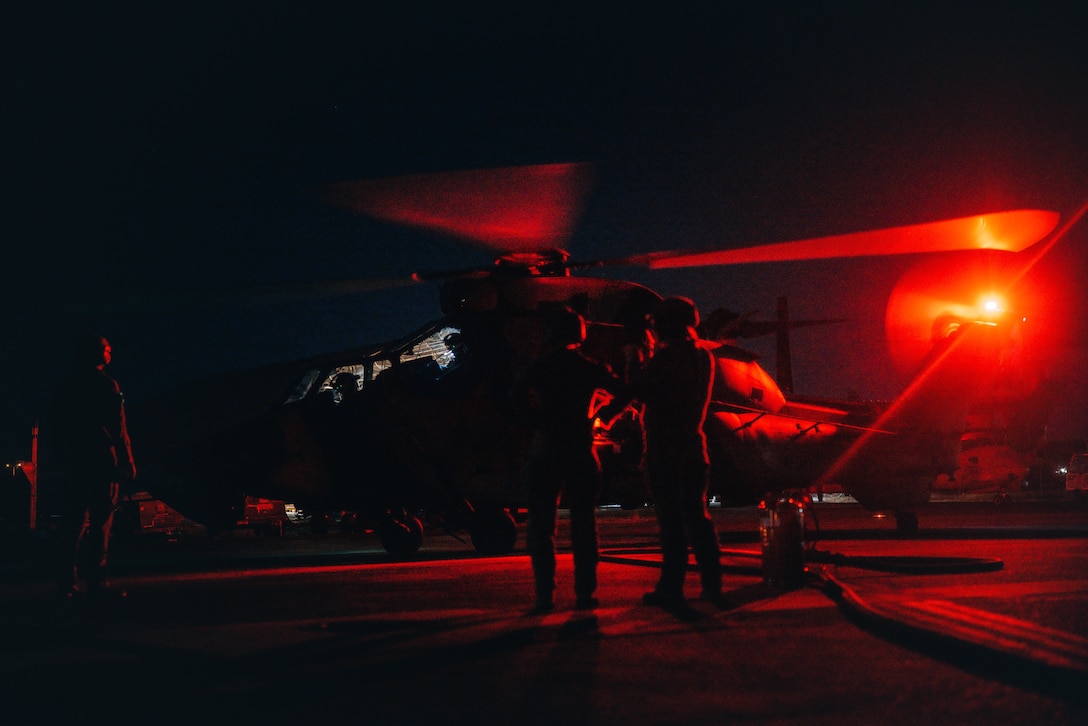 U.S. Marines with Marine Rotational Force – Darwin 25.3 and Australian soldiers from the 1st Aviation Regiment refuel an Australian ARH Tiger helicopter using a tactical aviation ground refueling system (TAGRS) at Royal Australian Air Force Base Darwin, Australia, July 08, 2025. This is the first time the TAGRS has been used to refuel an Australian aircraft, marking a new milestone in bilateral expeditionary refueling operations. MRF-D 25.3 is part of an annual six-month rotational deployment to enhance interoperability with the Australian Defence Force and Allies and partners and provide a forward-postured crisis response force in the Indo-Pacific. (U.S. Marine Corps photo by Sgt. Brian A. Stippey)