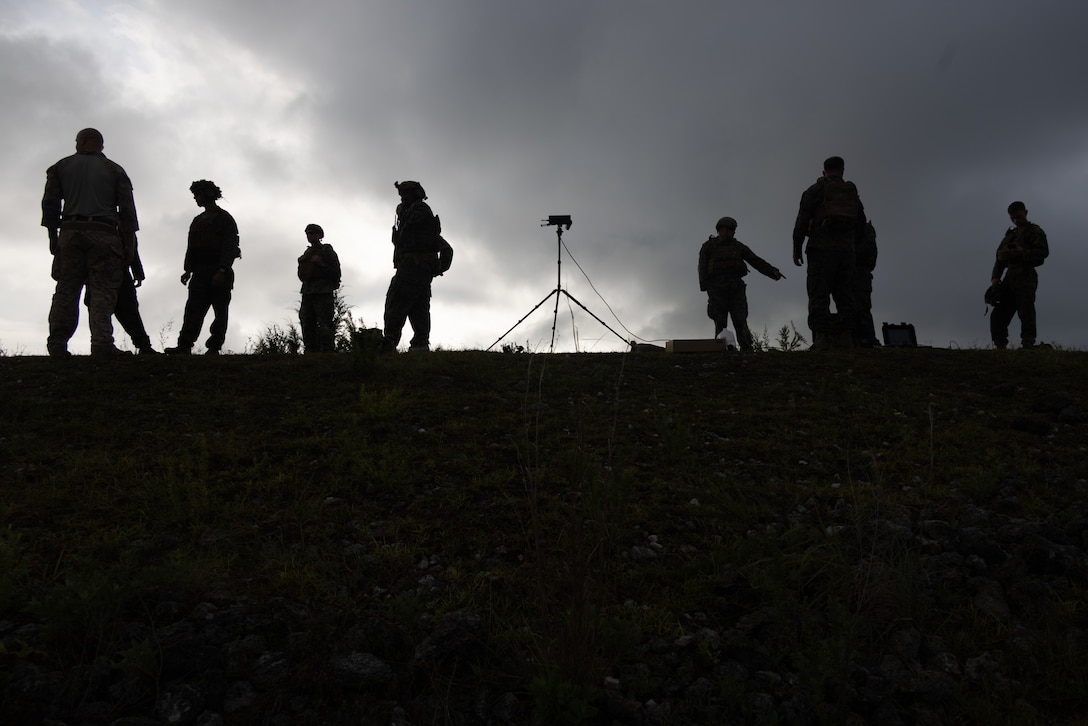 U.S. Marines with Advanced Infantry Training Battalion, School of Infantry – East prepare to launch a Neros Archer small unmanned aircraft system (SUAS) during a combined arms live-fire training exercise involving the employment of SUAS to deliver munitions on designated targets at Camp Lejeune, North Carolina, July 3, 2025. This event marked the first time munitions were employed from SUAS during a live-fire training exercise on Camp Lejeune, demonstrating the capability of integrating aerial strike capabilities at the tactical level.