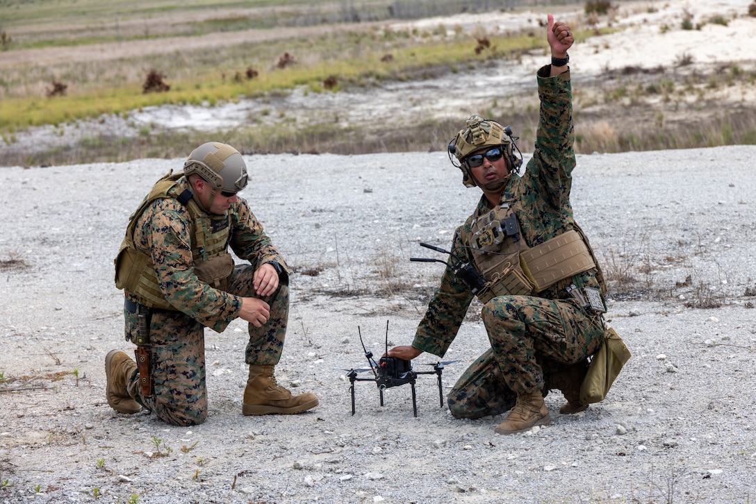 U.S. Marine Corps Chief Warrant Officer 5 Steven Pearsoll, an explosives ordinance officer with Weapons Training Battalion, and Gunnery Sgt. Kyle McDannell, the staff non-commissioned officer in charge of Infantry Unit Leaders Company, Advanced Infantry Training Battalion, School of Infantry – East, and a native of Maryland, functions check a Neros Archer small unmanned aircraft system (SUAS) in preparation for a combined arms live-fire training exercise involving the employment of SUAS to deliver munitions on designated targets at Camp Lejeune, North Carolina, July 2, 2025. This event marked the first time munitions were employed from SUAS during a live-fire training exercise on Camp Lejeune, demonstrating the capability of integrating aerial strike capabilities at the tactical level.