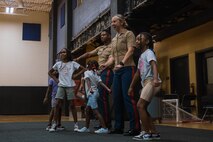 U.S. Marine Corps Staff Sgt. Gustavo Felix, right, a drill instructor with Charlie Company, 1st Recruit Training Battalion, Marine Corps Recruit Depot San Diego, speaks to members of the Marillac Saint Vincent during Marine Week Chicago, Illinois, July 10, 2025. During Marine Week Chicago, Marines with Marine Corps Recruiting Command shared Marine Corps traditions with local high schools in honor of the Corps’ 250th birthday. The Marine Corps is celebrating its 250th birthday with six multi-day Marine Corps community events, called Marine Weeks, in six major cities across the country. Marine Weeks will include activities across each host city featuring aircraft, equipment, recruiting opportunities, and public engagements. (U.S. Marine Corps photo by Cpl. Sarah Grawcock)
