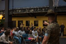 U.S. Marine Corps Staff Sgt. Gustavo Felix, right, a drill instructor with Charlie Company, 1st Recruit Training Battalion, Marine Corps Recruit Depot San Diego, speaks to members of the Marillac Saint Vincent during Marine Week Chicago, Illinois, July 10, 2025. During Marine Week Chicago, Marines with Marine Corps Recruiting Command shared Marine Corps traditions with local high schools in honor of the Corps’ 250th birthday. The Marine Corps is celebrating its 250th birthday with six multi-day Marine Corps community events, called Marine Weeks, in six major cities across the country. Marine Weeks will include activities across each host city featuring aircraft, equipment, recruiting opportunities, and public engagements. (U.S. Marine Corps photo by Cpl. Sarah Grawcock)
