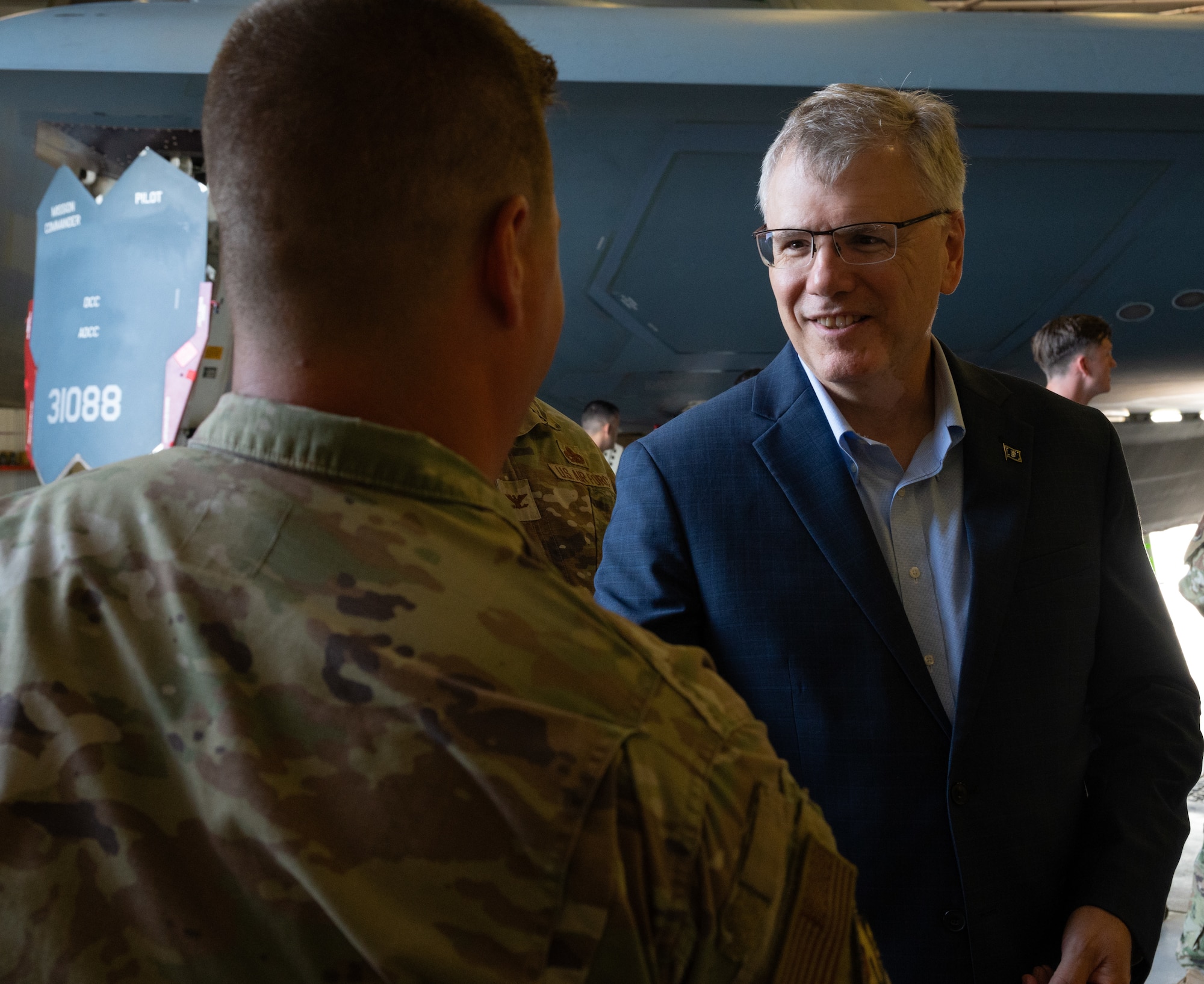 Secretary of the Air Force Troy Meink coins an Airman at Whiteman Air Force Base, Missouri, July 10, 2025.