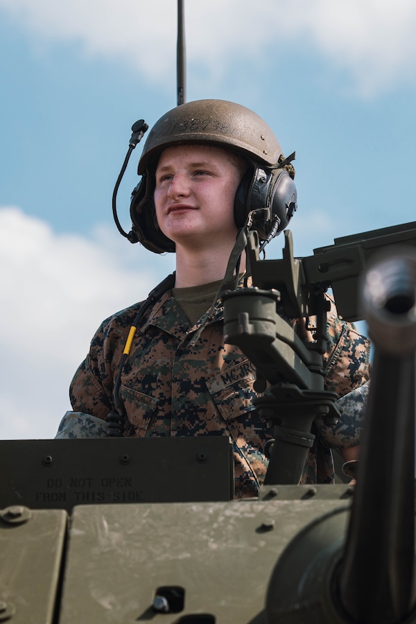 A member with the Marine Corps Junior Reserve Officers’ Training Corps poses for a picture at Romeoville High School during Marine Week Chicago, Illinois, July 10, 2025. During Marine Week Chicago, Marines with Marine Corps Recruiting Command shared Marine Corps traditions with local high schools in honor of the Corps’ 250th birthday. The Marine Corps is celebrating its 250th birthday with six multi-day Marine Corps community events, called Marine Weeks, in six major cities across the country. Marine Weeks will include activations across each host city featuring aircraft, equipment, recruiting opportunities, and public engagements. (U.S. Marine Corps photo by Cpl. Sarah Grawcock)