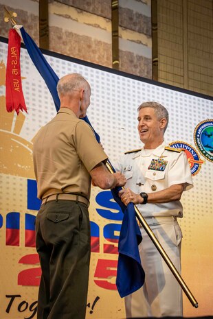 U.S. Marine Corps Lt. Gen. James Glynn, left, commander, U.S. Marine Corps Forces, Pacific, receives the Pacific Amphibious Leaders Symposium 25 flag from U.S. Navy Adm. Stephen Koehler, commander, U.S. Pacific Fleet, during the closing ceremony at the 11th iteration of PALS, Manila, Philippines, July 10, 2025. Bringing together experts and leaders from across the Indo-Pacific, PALS fosters collaboration among Allied and partner amphibious and maritime forces to share knowledge and recent operational insights. This year’s symposium hosted senior leaders from 23 participating nations who are committed to a free and open Indo-Pacific, with the objective of strengthening and developing regional relationships. (U.S. Marine Corps photo by Lance Cpl. Moses S. Lopez Franco)