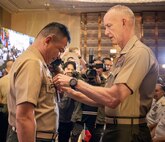 U.S. Marine Corps Lt. Gen. James Glynn, right, commander, U.S. Marine Corps Forces, Pacific, clips a symbolic pin onto the 37th Commandant of the Philippine Marine Corps, Maj. Gen. Vicente Blanco, during the closing ceremony at the 11th iteration of the Pacific Amphibious Leaders Symposium, Manila, Philippines, July 10, 2025. Bringing together experts and leaders from across the Indo-Pacific, PALS fosters collaboration among Allied and partner amphibious and maritime forces to share knowledge and recent operational insights. This year’s symposium hosted senior leaders from 23 participating nations who are committed to a free and open Indo-Pacific, with the objective of strengthening and developing regional relationships. (U.S. Marine Corps photo by Lance Cpl. Moses S. Lopez Franco)