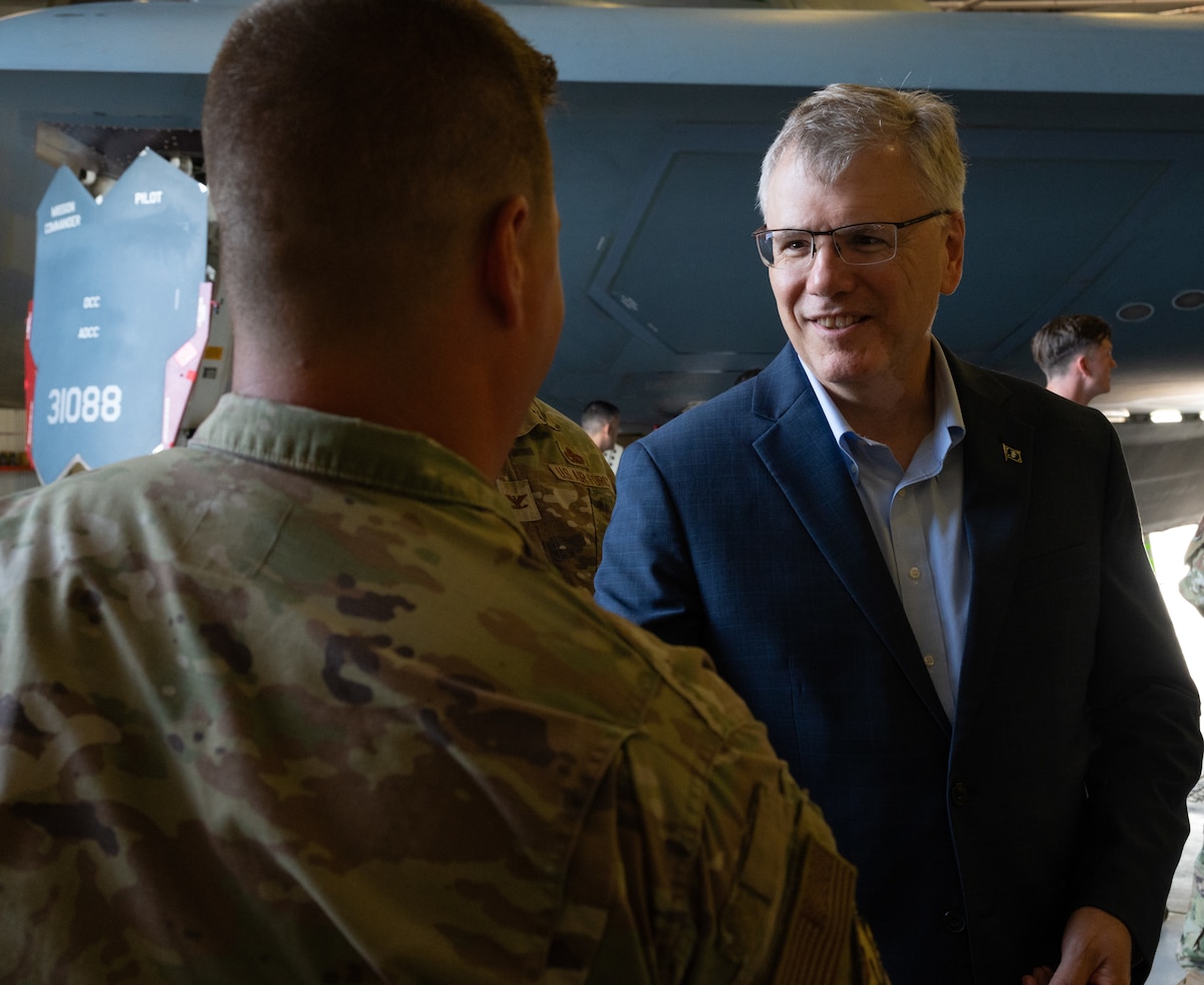 Secretary of the Air Force Troy Meink coins an Airman at Whiteman Air Force Base, Missouri, July 10, 2025.