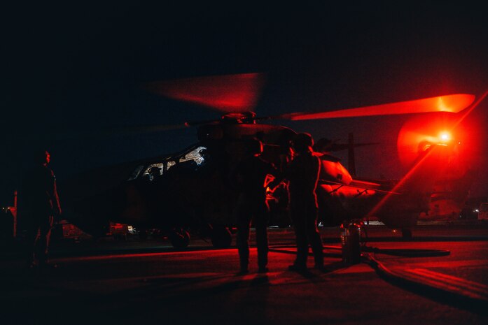 U.S. Marines with Marine Rotational Force – Darwin 25.3 and Australian soldiers from the 1st Aviation Regiment refuel an Australian ARH Tiger helicopter using a tactical aviation ground refueling system (TAGRS) at Royal Australian Air Force Base Darwin, Australia, July 08, 2025.