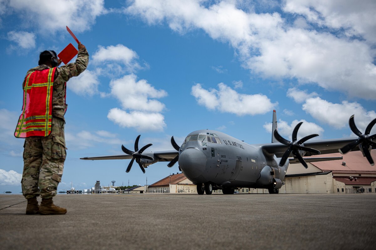 U.S. Air Force Staff Sgt. Quincy Mendoza, 35th Maintenance Squadron transient alert craftsmen, marshals in a U.S. Air Force C-130J Super Hercules in support of exercise Resolute Force Pacific (REFORPAC) 2025 at Misawa Air Base, Japan, July 10, 2025.