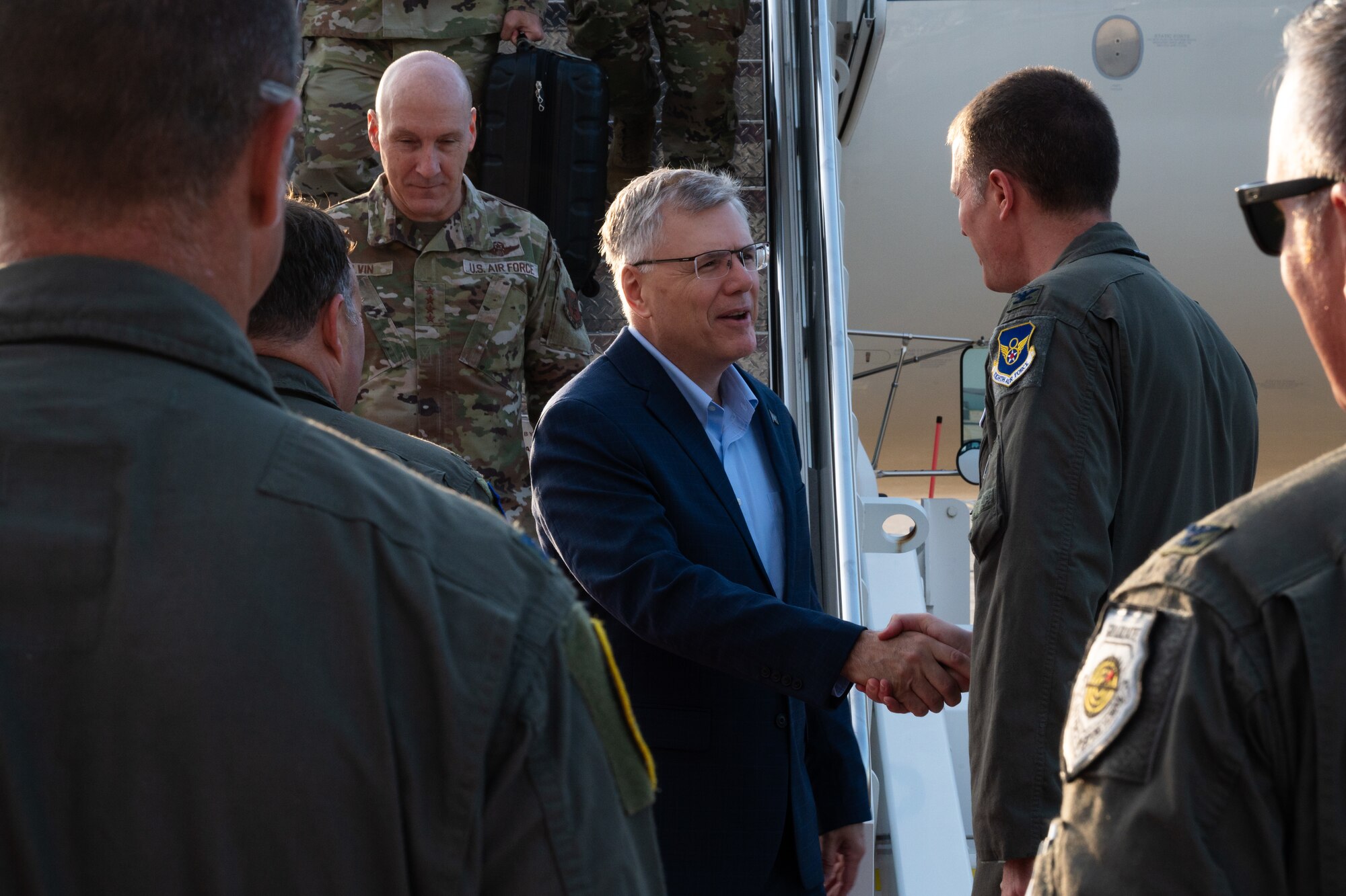 U.S. Air Force Col. Joshua Wiitala, 509th Bomb Wing commander, right, greets Secretary of the Air Force Troy Meink at Whiteman Air Force Base, Missouri, July 10, 2025.