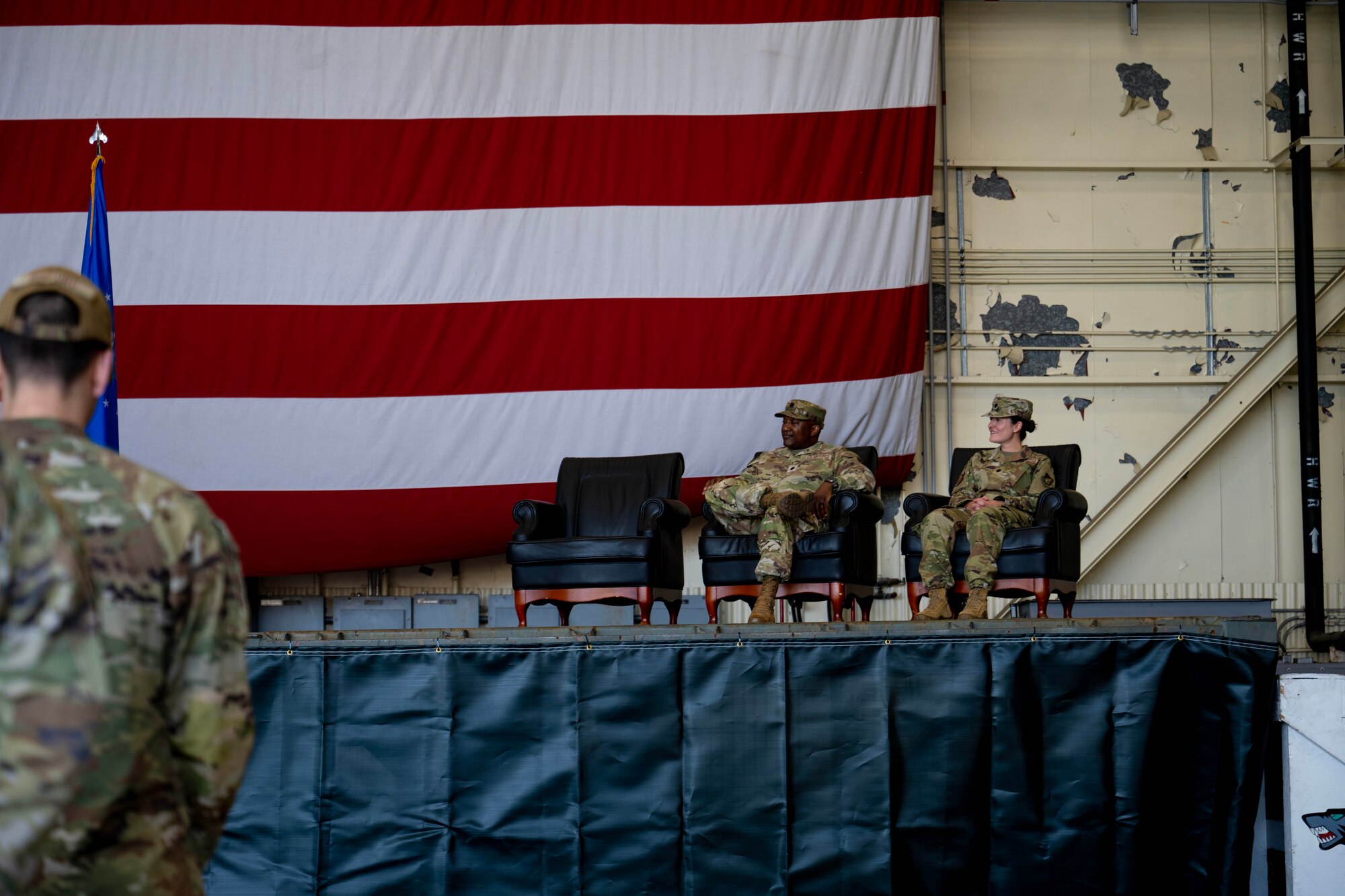 U.S. Air Force Lt. Col. Alfred Doby, outgoing 8th Operational Medical Readiness Squadron commander, and Lt. Col. Sarah Kelly, incoming 8th Operational Medical Readiness Squadron commander, prepare to change command
