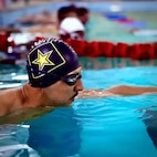 Ret. Sgt. 1st Class Escobedo on the wall waiting as he prepares for the Warrior Games.