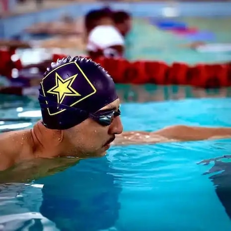 Ret. Sgt. 1st Class Escobedo on the wall waiting as he prepares for the Warrior Games.