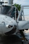 U.S. Marine Corps Maj. Daphne Kelly, a pilot (left), and Cpl. Noah Balagtas, an aircraft avionics technician with Marine Light Attack Helicopter Squadron (HMLA) 773, 4th Marine Aircraft Wing, assigned to Special Marine Air-Ground Task Force-250 carry out pre-flight checks on a UH-1Y Venom helicopter during an outreach and engagement flight during Marine Week Chicago, July 11, 2025. This year, the Marine Corps will celebrate two and a half centuries of serving the Nation with honor, courage, and commitment. (U.S. Marine Corps photo by Cpl. Diana Salgado)