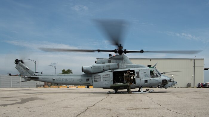 U.S. Marines with Marine Light Attack Helicopter Squadron (HMLA) 773, 4th Marine Aircraft Wing, assigned to Special Marine Air-Ground Task Force-250 initate a take off sequence on a UH-1Y Venom helicopter as part of an outreach and engagement flight during Marine Week Chicago, July 11, 2025. This year, the Marine Corps will celebrate two and a half centuries of serving the Nation with honor, courage, and commitment. (U.S. Marine Corps photo by Cpl. Diana Salgado)