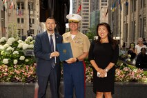 Kevin Barszcz, the director of Veterans Affairs for Chicago, left, U.S Marine Corps Col. J.J. Wilson, the commanding officer of Special Purpose Marine Air-Ground Task Force-250, center, and Tracey Campbell, the director of community relations for the U.S. Marine Corps, pose for a photo during Marine Week Chicago, July 10, 2025. The opening ceremony signifies the start of the event and presents the ethos of U.S. Marines to Chicago residents. Throughout 2025, Marines across the globe will celebrate the 250th birthday of the Corps, commemorating service, sacrifice, and priding themselves on living ‘Semper Fidelis’ or ‘Always Faithful’ to their nation and to each other. (U.S. Marine Corps photo by Lance Cpl. Elijua Guel)