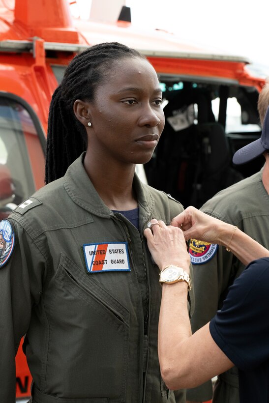 Secretary Kristi Noem presents medals to Lieutenant Ian Hopper, Lieutenant Blair Oguiofor, Petty Officer 3rd Class Scott Ruskan, and Petty Officer 3rd Class Seth Reece of Air Station Corpus Christi during a ceremony on July 11, 2025. The medals recognize their roles in the Camp Mystic rescue on July 4, when Coast Guard crews evacuated dozens of campers and staff amid flash flooding at the Guadalupe River.