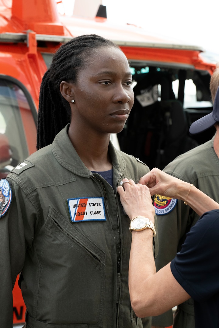 Secretary Kristi Noem presents medals to Lieutenant Ian Hopper, Lieutenant Blair Oguiofor, Petty Officer 3rd Class Scott Ruskan, and Petty Officer 3rd Class Seth Reece of Air Station Corpus Christi during a ceremony on July 11, 2025. The medals recognize their roles in the Camp Mystic rescue on July 4, when Coast Guard crews evacuated dozens of campers and staff amid flash flooding at the Guadalupe River.