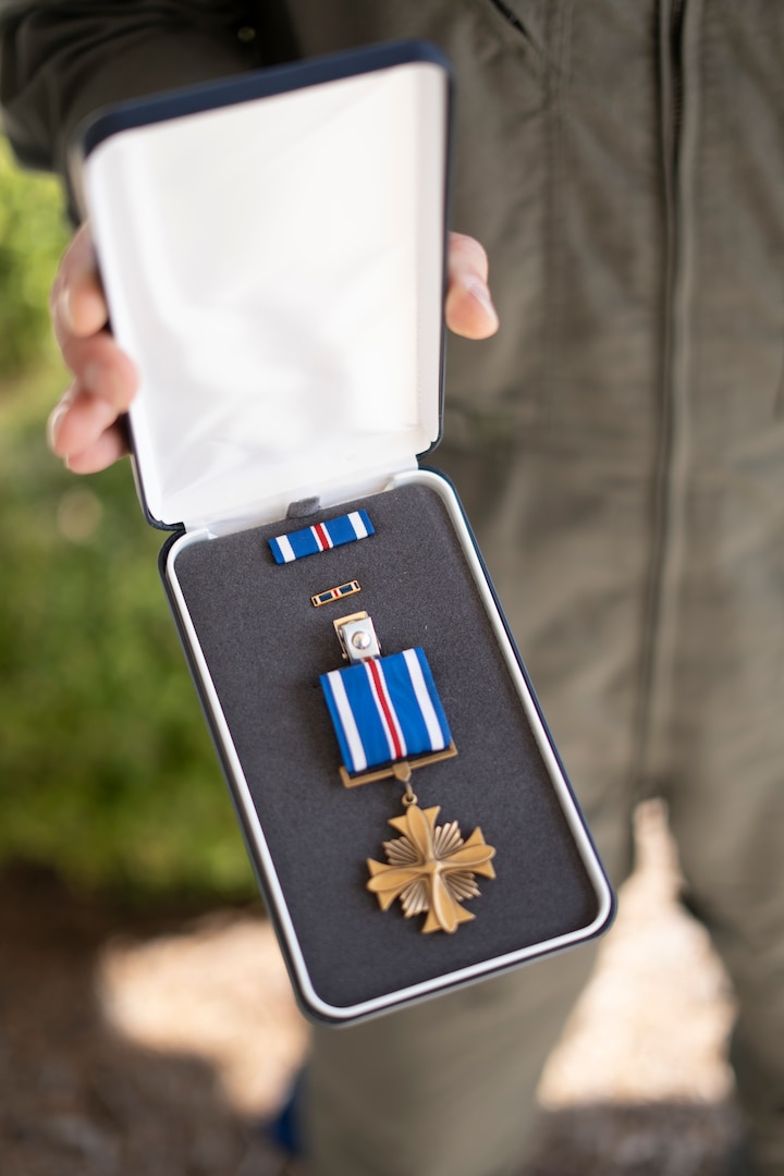 Secretary Kristi Noem presents medals to Lieutenant Ian Hopper, Lieutenant Blair Oguiofor, Petty Officer 3rd Class Scott Ruskan, and Petty Officer 3rd Class Seth Reece of Air Station Corpus Christi during a ceremony on July 11, 2025. The medals recognize their roles in the Camp Mystic rescue on July 4, when Coast Guard crews evacuated dozens of campers and staff amid flash flooding at the Guadalupe River.