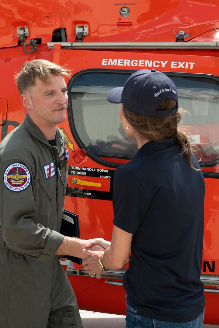 Secretary Kristi Noem presents medals to Lieutenant Ian Hopper, Lieutenant Blair Oguiofor, Petty Officer 3rd Class Scott Ruskan, and Petty Officer 3rd Class Seth Reece of Air Station Corpus Christi during a ceremony on July 11, 2025. The medals recognize their roles in the Camp Mystic rescue on July 4, when Coast Guard crews evacuated dozens of campers and staff amid flash flooding at the Guadalupe River.