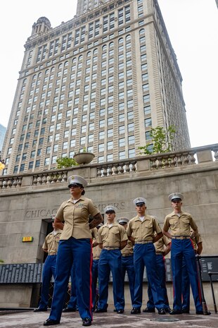U.S. Marines assigned to Special Purpose Marine Air-Ground Task Force-250 stand in formation for a wreath laying ceremony at the Vietnam Veterans Memorial during Marine Week Chicago, July 11, 2025. The wreath laying ceremony was held to honor U.S. Marine Corps Sgt. Thomas Gilbert and other Marines who paid the ultimate sacrifice during Operation Iraqi Freedom. This year, the Marine Corps will celebrate two and a half centuries of serving the nation with honor, courage, and commitment. (U.S. Marine Corps photo by Lance Cpl. Elijua Guel)