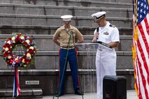 U.S. Navy Lt. Cmdr. Nathan Hays, the chaplain assigned to Special Purpose Marine Air-Ground Task Force-250, leads a prayer for a wreath laying ceremony at the Vietnam Veterans Memorial during Marine Week Chicago, July 11, 2025. The wreath laying ceremony was held to honor U.S. Marine Corps Sgt. Thomas Gilbert and other Marines who paid the ultimate sacrifice during Operation Iraqi Freedom. This year, the Marine Corps will celebrate two and a half centuries of serving the nation with honor, courage, and commitment. (U.S. Marine Corps photo by Lance Cpl. Elijua Guel)