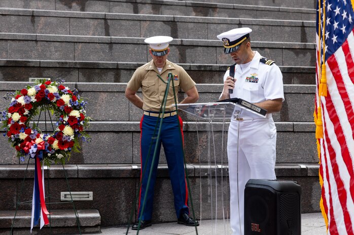 U.S. Navy Lt. Cmdr. Nathan Hays, the chaplain assigned to Special Purpose Marine Air-Ground Task Force-250, leads a prayer for a wreath laying ceremony at the Vietnam Veterans Memorial during Marine Week Chicago, July 11, 2025. The wreath laying ceremony was held to honor U.S. Marine Corps Sgt. Thomas Gilbert and other Marines who paid the ultimate sacrifice during Operation Iraqi Freedom. This year, the Marine Corps will celebrate two and a half centuries of serving the nation with honor, courage, and commitment. (U.S. Marine Corps photo by Lance Cpl. Elijua Guel)