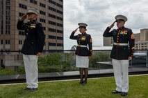 U.S. Marines assigned to Special Purpose Marine Air-Ground Task Force-250 salute during a ceremony for Jamaria Peters at the Willis Tower during Marine Week Chicago, July 11, 2025. The event featured a performance from the Marine Corps Silent Drill Platoon, music from the Quantico Marine Band, and the appearance of drill instructors from Marine Corps Recruit Depot San Diego. This year, the Marine Corps will celebrate two and a half centuries of serving the nation with honor, courage, and commitment. (U.S. Marine Corps photo by Lance Cpl. Elijua Guel)