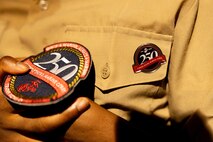 A Marines 250 sticker sits on the chest of Jamaria Peters, a Make-A-Wish recipient, during a ceremony dedicated to him at the Willis Tower during Marine Week Chicago, July 11, 2025. The event featured a performance from the Marine Corps Silent Drill Platoon, music from the Quantico Marine Band, and the appearance of drill instructors from Marine Corps Recruit Depot San Diego. This year, the Marine Corps will celebrate two and a half centuries of serving the nation with honor, courage, and commitment. (U.S. Marine Corps photo by Lance Cpl. Elijua Guel)