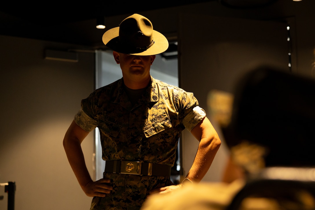 U.S. Marine Corps Staff Sgt. Joshua Pontius, a drill instructor with Instructional Training Company, Support Battalion, Marine Corps Recruit Depot San Diego, interacts with Jamaria Peters, a Make-A-Wish recipient, during a ceremony for Peters at the Willis Tower during Marine Week Chicago, July 11, 2025. The event featured a performance from the Marine Corps Silent Drill Platoon, music from the Quantico Marine Band, and the appearance of drill instructors from the Marine Corps Recruit Depot San Diego. This year, the Marine Corps will celebrate two and a half centuries of serving the nation with honor, courage, and commitment. (U.S. Marine Corps photo by Lance Cpl. Elijua Guel)