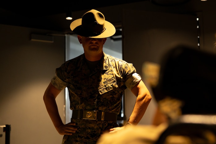 U.S. Marine Corps Staff Sgt. Joshua Pontius, a drill instructor with Instructional Training Company, Support Battalion, Marine Corps Recruit Depot San Diego, interacts with Jamaria Peters, a Make-A-Wish recipient, during a ceremony for Peters at the Willis Tower during Marine Week Chicago, July 11, 2025. The event featured a performance from the Marine Corps Silent Drill Platoon, music from the Quantico Marine Band, and the appearance of drill instructors from the Marine Corps Recruit Depot San Diego. This year, the Marine Corps will celebrate two and a half centuries of serving the nation with honor, courage, and commitment. (U.S. Marine Corps photo by Lance Cpl. Elijua Guel)