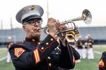 U.S. Marine Corps Staff Sgt. Nicholas Galo, a trumpet player and brass band leader with the Quantico Marine Band, plays the trumpet at Romeoville High School during Marine Week Chicago on July, 10 2025. Marines with Marine Corps Recruiting Command shared Marine Corps traditions with local high schools in honor of the Corps’ 250th birthday. The Marine Corps is celebrating its 250th birthday with six multi-day Marine Corps community events, called Marine Weeks, in six major cities across the country. Marine Weeks will include activations across each host city featuring aircraft, equipment, recruiting opportunities, and public engagements. (U.S. Marine Corps photo by Staff Sgt. Brandon Salas)