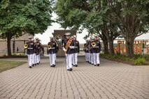 U.S. Marine Corps Band Quantico performs at Romeoville High School during Marine Week Chicago, July 10, 2025. During Marine Week Chicago, Marines with Marine Corps Recruiting Command shared Marine Corps traditions with local high schools in honor of the Corps’ 250th birthday. The Marine Corps is celebrating its 250th birthday with six multi-day Marine Corps community events, called Marine Weeks, in six major cities across the country. Marine Weeks will include activations across each host city featuring aircraft, equipment, recruiting opportunities, and public engagements. (U.S. Marine Corps photo by Staff Sgt. Brandon Salas)
