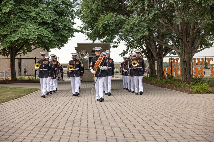 U.S. Marine Corps Band Quantico performs at Romeoville High School during Marine Week Chicago, July 10, 2025. During Marine Week Chicago, Marines with Marine Corps Recruiting Command shared Marine Corps traditions with local high schools in honor of the Corps’ 250th birthday. The Marine Corps is celebrating its 250th birthday with six multi-day Marine Corps community events, called Marine Weeks, in six major cities across the country. Marine Weeks will include activations across each host city featuring aircraft, equipment, recruiting opportunities, and public engagements. (U.S. Marine Corps photo by Staff Sgt. Brandon Salas)