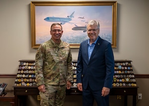 U.S. Air Force Gen. Johnny Lamontagne, Air Mobility Command commander, and Secretary of the Air Force Troy Meink pose for a photo in front of AMC’s coin display at Scott Air Force Base, Illinois, July 9, 2025. Lamontagne and Meink discussed the success of the mission and AMC priorities . (U.S. Air Force photo by Staff Sgt. Ethan Sherwood)