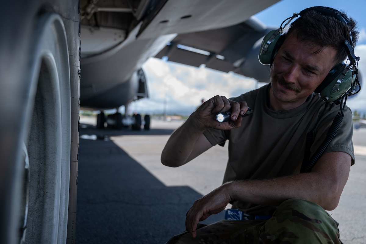 U.S. Air Force Tech. Sgt. Andrew Miller, 436th Maintenance Squadron repair and reclamation noncommissioned officer in charge, conducts post-flight inspections on a C-5M Super Galaxy aircraft assigned to the 439th Airlift Wing in support of the Air Force’s 2025 Department-Level Exercise series at Joint Base Pearl Harbor-Hickam, Hawai’i, July 10, 2025. This mission is part of the first-in-a-generation DLE series, a new way of conducting operations in a contested, dynamic environment to build capabilities making a stronger, more lethal deterrent force. The DLE series encompasses all branches of the Department of Defense, along with Allies and partners, employing more than 400 Joint and coalition aircraft and more than 12,000 members at more than 50 locations across 3,000 miles. (U.S. Air Force photo by Tech. Sgt. Monica Roybal)