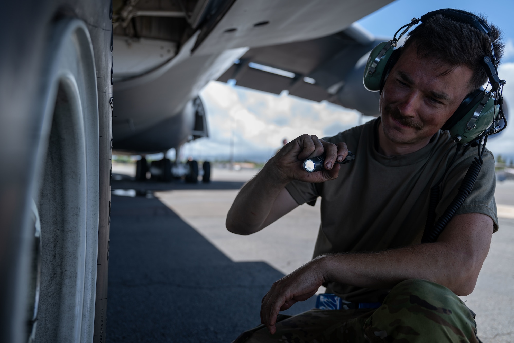 U.S. Air Force Tech. Sgt. Andrew Miller, 436th Maintenance Squadron repair and reclamation noncommissioned officer in charge, conducts post-flight inspections on a C-5M Super Galaxy aircraft assigned to the 439th Airlift Wing in support of the Air Force’s 2025 Department-Level Exercise series at Joint Base Pearl Harbor-Hickam, Hawai’i, July 10, 2025. This mission is part of the first-in-a-generation DLE series, a new way of conducting operations in a contested, dynamic environment to build capabilities making a stronger, more lethal deterrent force. The DLE series encompasses all branches of the Department of Defense, along with Allies and partners, employing more than 400 Joint and coalition aircraft and more than 12,000 members at more than 50 locations across 3,000 miles. (U.S. Air Force photo by Tech. Sgt. Monica Roybal)