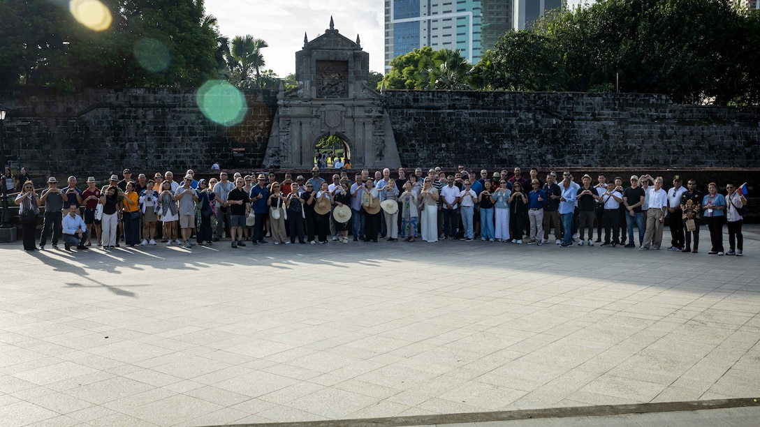 Senior leaders and guests from across the Indo-Pacific pose for a photo following a tour of Intramuros as part of the 11th iteration of the Pacific Amphibious Leaders Symposium, Manila, Philippines, July 10, 2025. Bringing together experts and leaders from across the Indo-Pacific, PALS fosters collaboration among Allied and partner amphibious and maritime forces to share knowledge and recent operational insights. This year’s symposium hosted senior leaders from 23 participating nations who are committed to a free and open Indo-Pacific, with the objective of strengthening and developing regional relationships. (U.S. Marine Corps photo by Lance Cpl. Moses S. Lopez Franco)