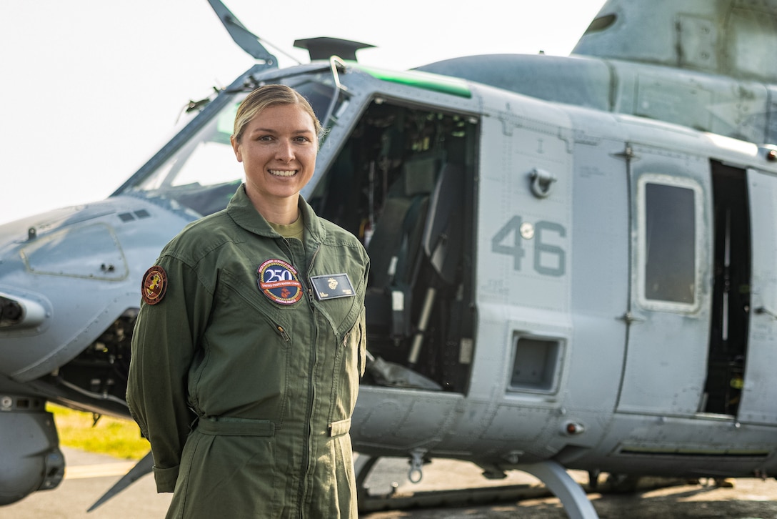 U.S. Marine Corps Gunnery Sgt. Sarah Decker, the maintenance control Non-Commissioned Officer in Charge with Marine Light Attack Helicopter Squadron-773, Marine Aircraft Group-49, 4th Marine Aircraft Wing, poses for a photo during an Orientation and Indoctrination Flight as part of Marine Week Nashville at John C. Tune Airport, Nashville, Tennessee, June 3, 2025. The O&I flights allowed an opportunity for community leaders around Nashville to see and experience Marine Corps aviation and interact with the Marines maintaining and flying these aircraft. Throughout 2025, Marines across the globe will celebrate the 250th birthday of the Corps, commemorating service, sacrifice, and priding themselves on living 'Semper Fidelis' or 'Always Faithful' to their nation and to each other. (U.S. Marine Corps photo by Lance Cpl. Judith Ann Lazaro)